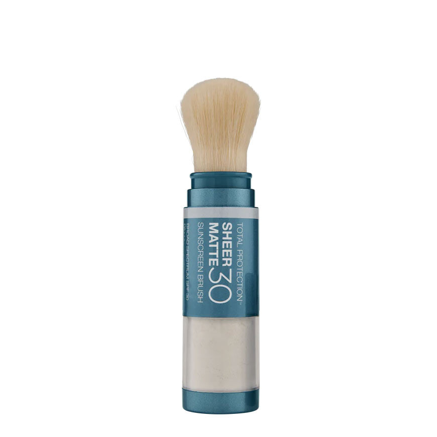 A compact mineral sunscreen brush with a matte finish, labeled SPF 30, in a beige shade, with a blue cap and a brush applicator.