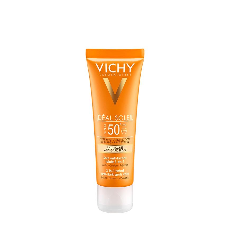 A tube of VICHY IDEAL SOLEIL ANTI DARK SPOT sunscreen with a high SPF rating, labeled in orange and white.