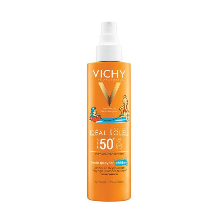 A bottle of VICHY IDEAL SOLEIL Kids Spray Sunscreen with SPF 50+. The packaging is predominantly orange with illustrations of children playing by the water and the VICHY brand logo.