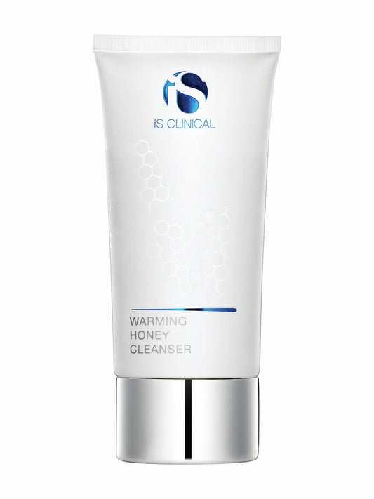 A white tube packaging of iS Clinical Warming Honey Cleanser with a blue accent on the cap.