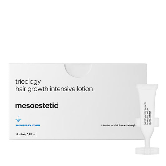 Packaging of Mesoestetic Tricology Hair Growth Intensive Lotion, with the product visible in a small white tube, against a white background.