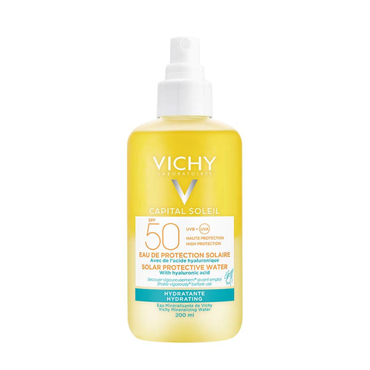 A pump bottle of VICHY CAPITAL SOLEIL PROTECTIVE WATERS sunscreen with a yellow label and 50+ protection indication.