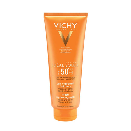 A tube of VICHY IDEAL SOLEIL SPF50+ MILK, family milk sunscreen for sensitive skin, with a non-greasy texture enriched with Hyaluronic Acid.