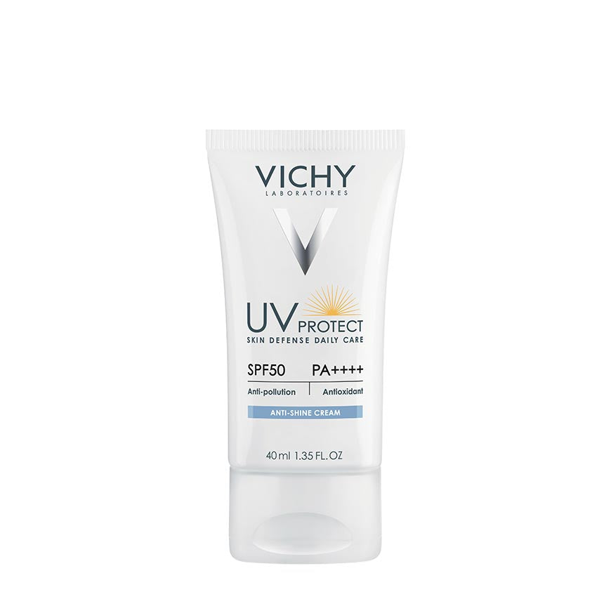 A tube of VICHY UV PROTECT ANTI-SHINE CREAM SPF50 with a white and blue packaging, indicating that it is a sun defense daily care product.