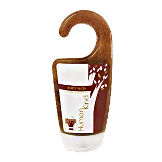 A hanging body wash bottle with a brown label featuring an orange design and text stating 'HumanKind'.