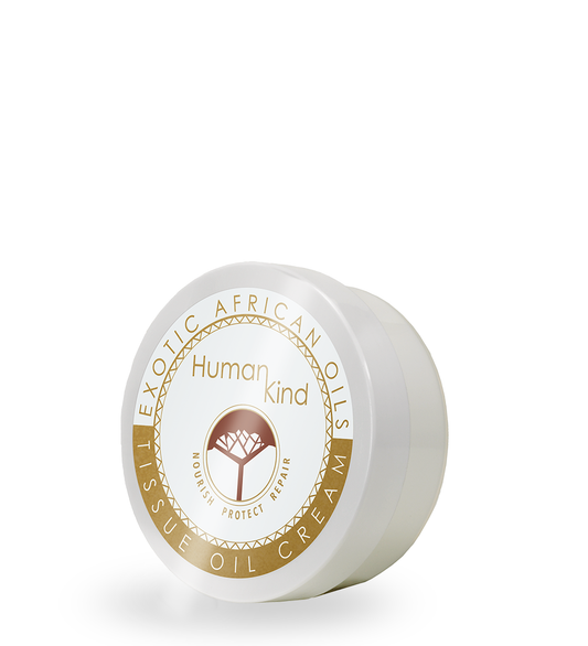 A white jar with a gold and brown label of HumanKind Tissue Oil Cream by Essel.
