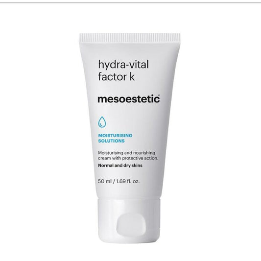 A white tube packaging of 'Hydra-Vital factor K' moisturizer by Mesoestetic with blue and grey text detailing the product's purpose for normal to dry skin types.