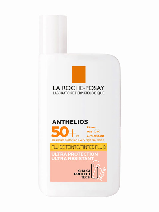 Bottle of La Roche-Posay Anthelios INVISIBLE TINTED FLUID SPF 50+ sunscreen.