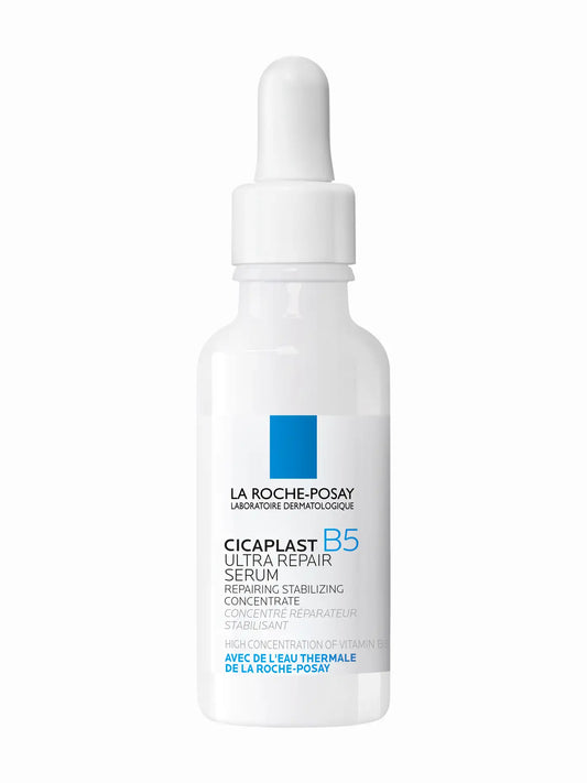 A bottle of La Roche-Posay Cicaplast B5 Ultra Repair Concentrate serum with a white and blue label.