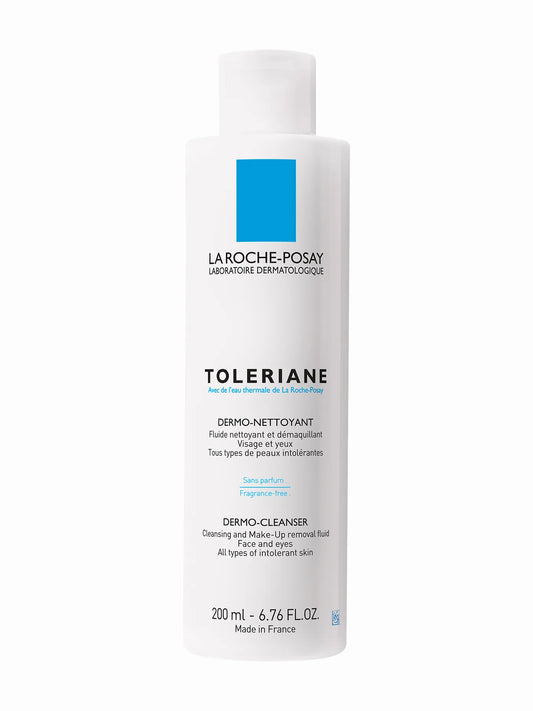 A bottle of La Roche-Posay Toleriane Dermo Cleanser with a white and blue label, indicating it is a product for dry and sensitive skin, 200ml in size, and made in France.