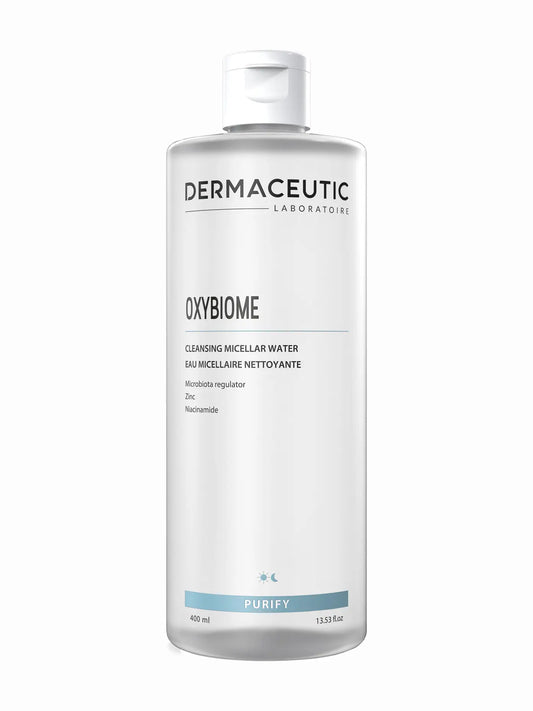 A bottle of Dermaceutic Oxybiome cleansing micellar water, with a label indicating it is for all skin types, including sensitive skin, and that it contains naturally-derived ingredients.