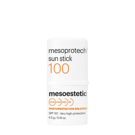 A white sunscreen stick with orange and black text detailing the product name and SPF level, against a clean background.