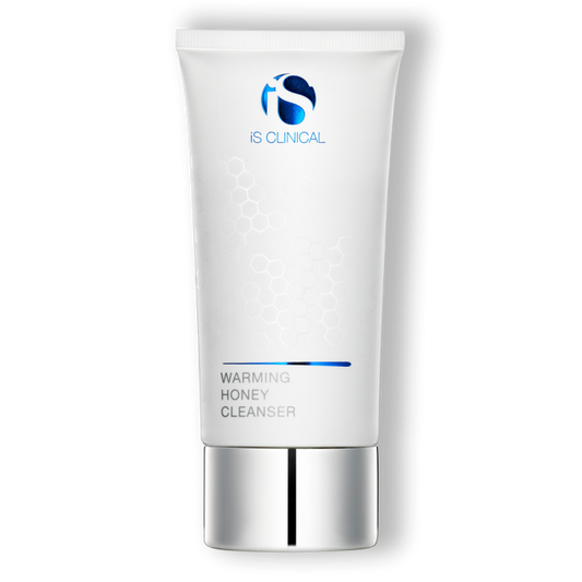 A tube of isClinical Warming Honey Cleanser with a white and blue design, indicating a moisturizing honey-based cleanser.